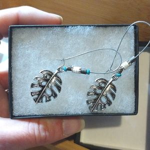 Leaf earrings with turquoise, brown and white stones.